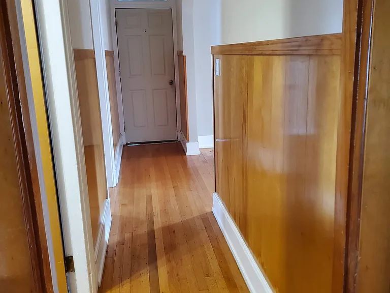 Hallway with front door shown; front door goes to landing area shared with 3rd floor