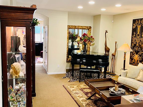 This room was made into a larger living area with the Baby Grand Piano but is designed for a Dining set and buffet.