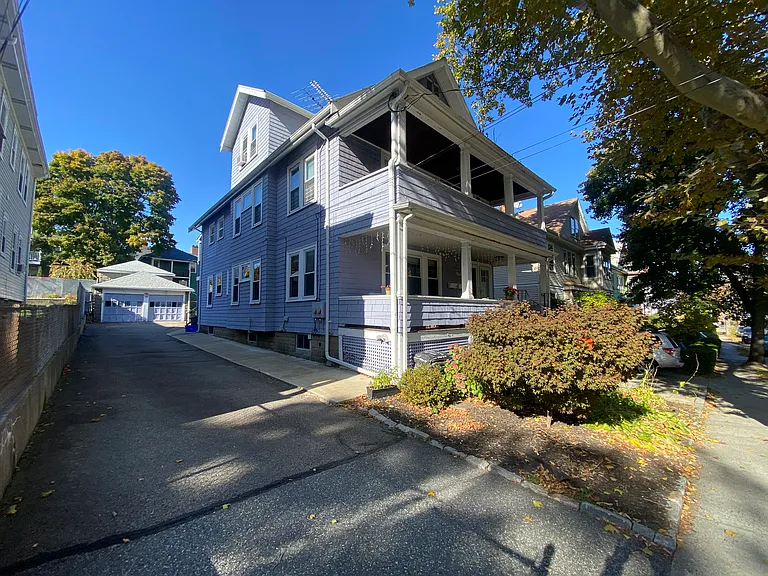 Exterior Front with Garage and Surface Lot Assigned