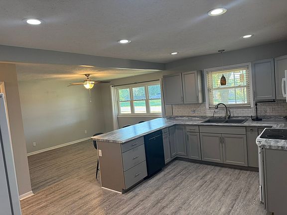 Kitchen. Includes stove, fridge, dishwasher, over stove microwave and a drinking water filtration system.