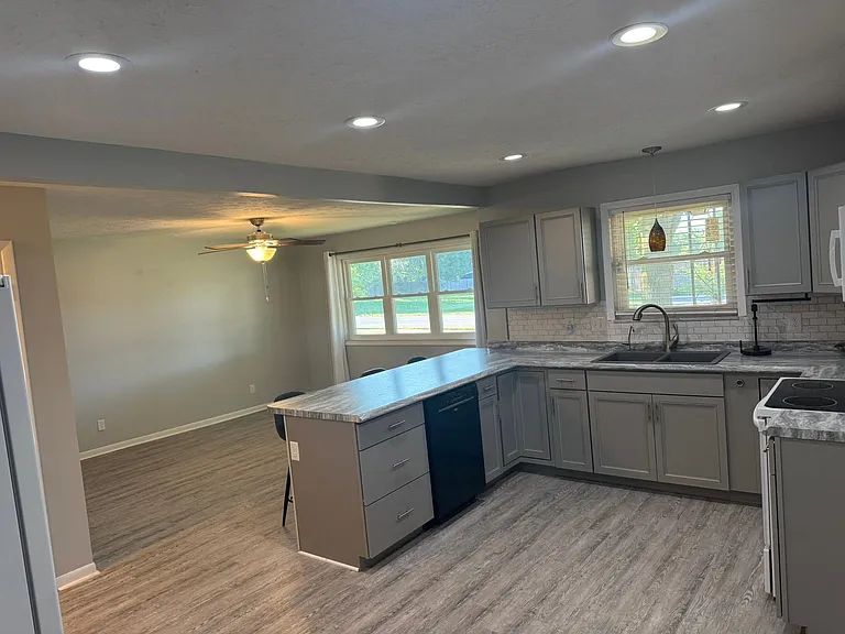 Kitchen. Includes stove, fridge, dishwasher, over stove microwave and a drinking water filtration system.