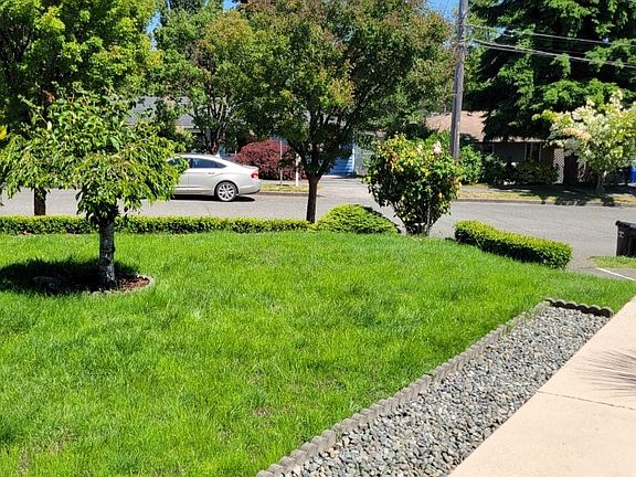 A paved walkway leads from your driveway through a nicely landscaped yard to your front door. Lawns have been recently reseeded.