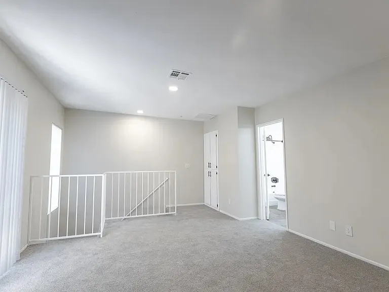 upstairs bedroom, linen closet, door to bathroom
