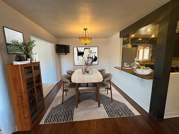 Open concept dining room with kitchen passthrough and open access to living room and Sunroom/mudroom