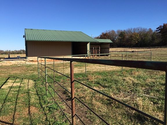 Detached Barn/workshp
						:
						Pipe Fence surrounds the entire 5 Acres.