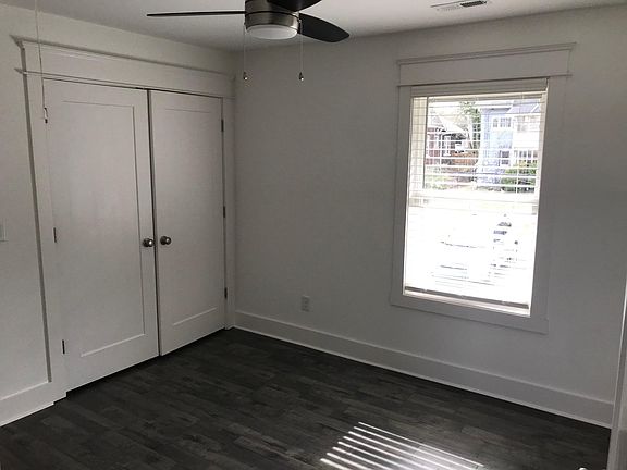 This unit is the guest (2nd) bedroom with large closet, oversized window and ceiling fan.