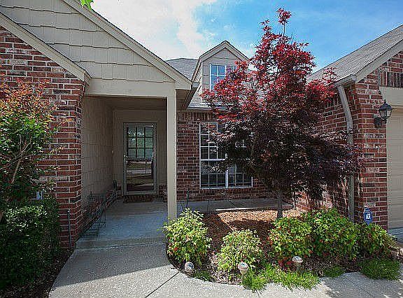 Covered porch and lots of greenery