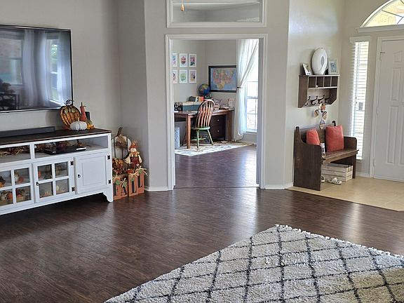 Living room looking into office with double doors