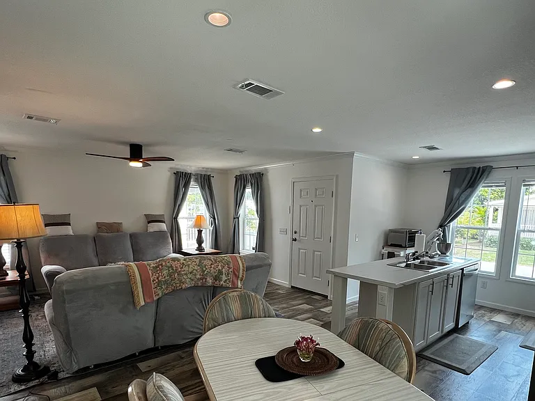 View of open floor plan: living room, kitchen and dining room.