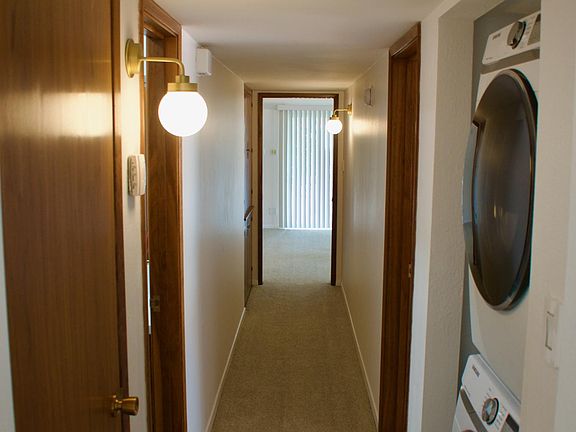 Hallway with indoor laundry