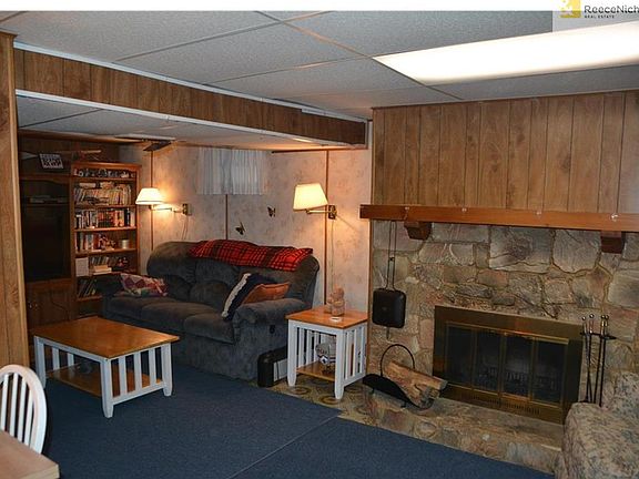 Cozy Family Room with Wood Burning Fireplace on lower level