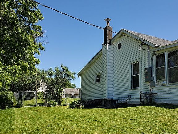 Left side of house with yard