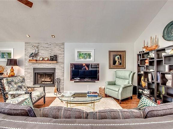 Living room has attractive windows, new flooring and opens onto the dining room