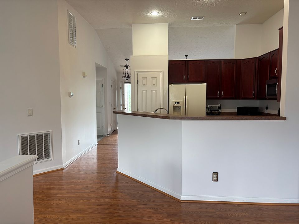 Soaring ceilings, and a modern kitchen with ample cabinetry