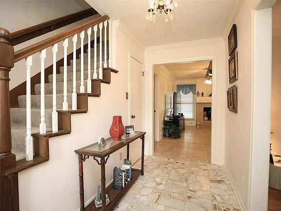 ENTRY - Spacious entry with large storage closet. Family room is straight ahead, and both formals are on the right.