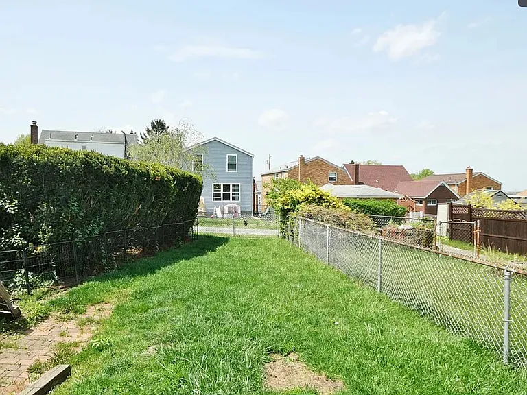 Fenced back yard w/alley access.