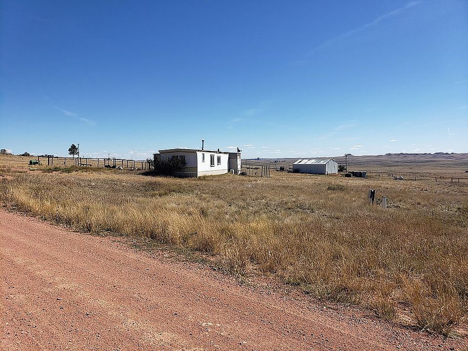 Trailer & shop in background