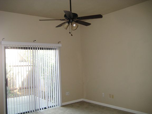 master bedrm has ceiling fan & slider to back
