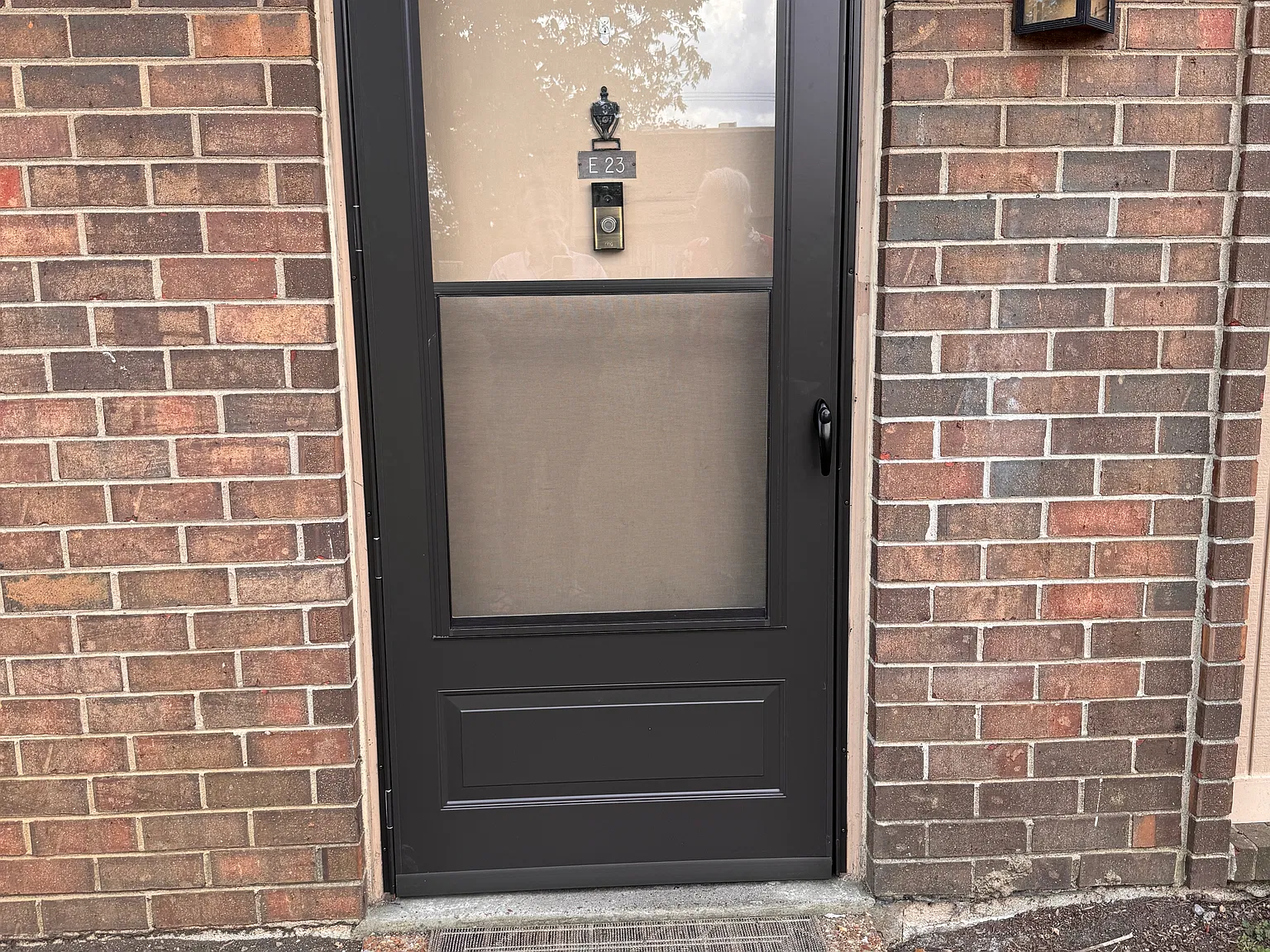 Front door with a screened storm door