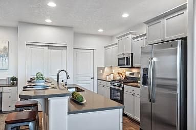 kitchen all in white with white appliances also