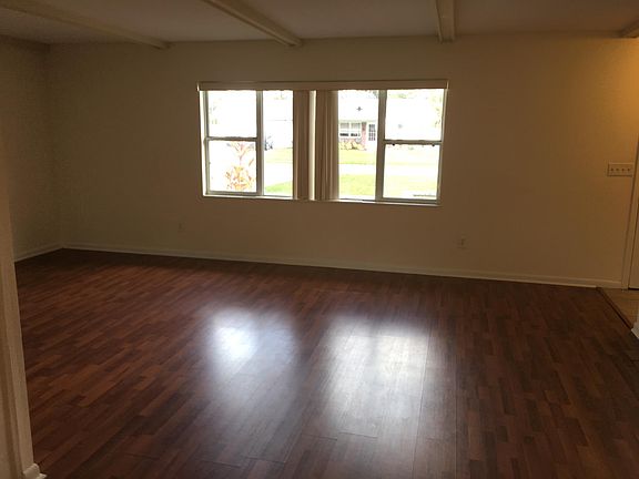Large living room with good natural lighting.