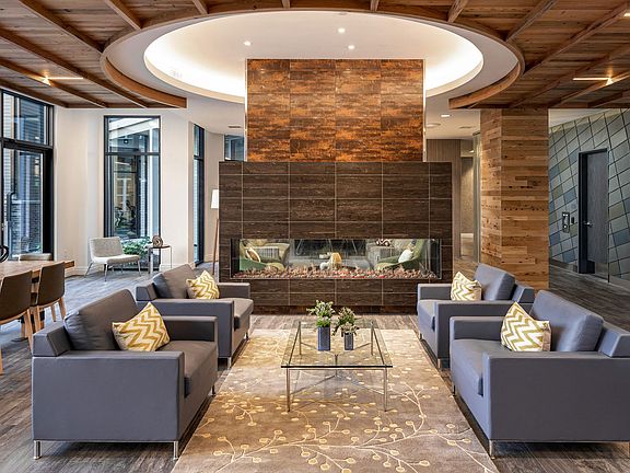 Cozy up by the fireplace in the Entertainment Lounge