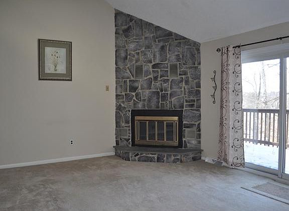 Family room w/vaulted ceiling and skylight.