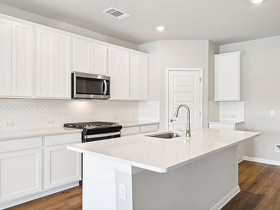 Cook your favorite meal in this beautiful kitchen.