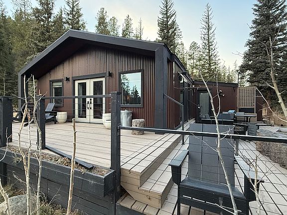 Wrap around deck with patio furnitue.