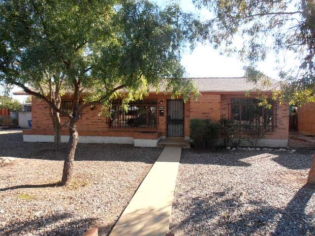 Handsome red brick home, low care yards, security bars and doors. Good neighborhood.