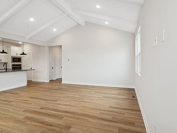 Open concept dining area, great room, and kitchen