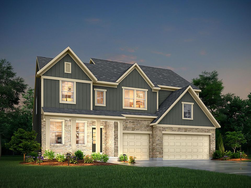 two-story home with board and batten, siding and stone