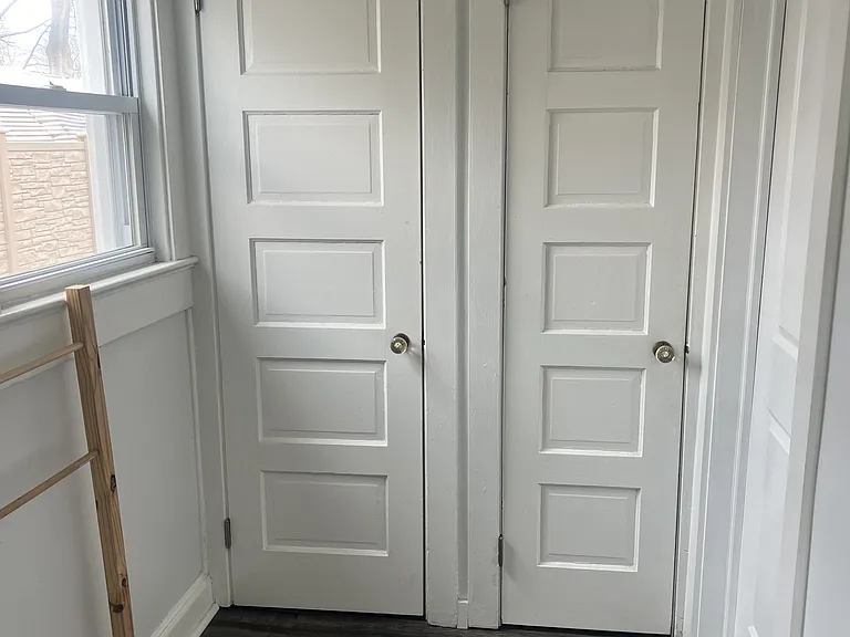 closet storage next to bathroom entrance