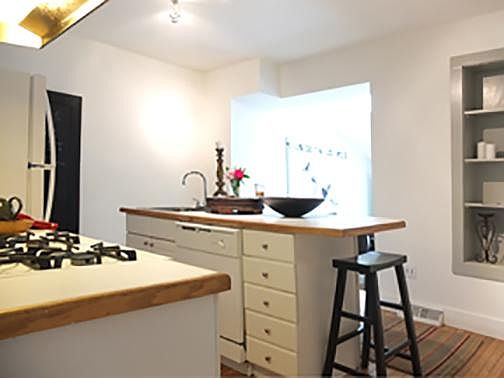 Kitchen with Island and sink in island.