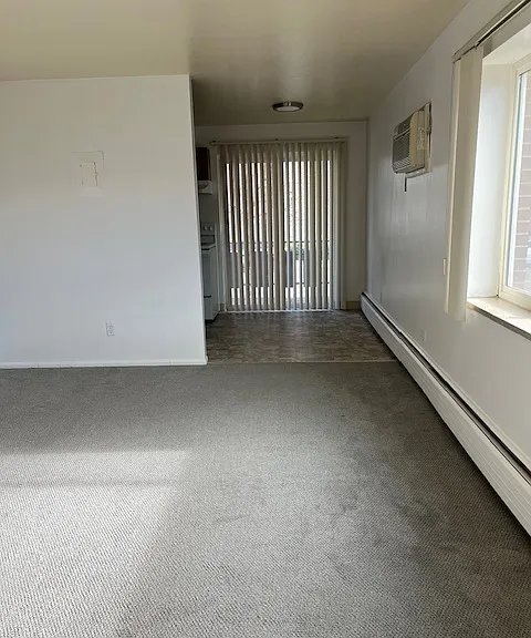 Living room perspective facing kitchen.