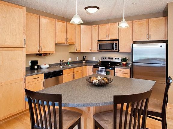 Spacious kitchen with center island, pantry and over-sized cabinets.