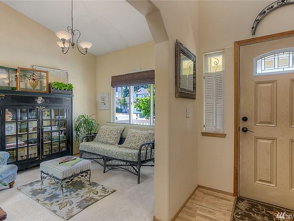 The formal living room sits just off the timber floored foyer.