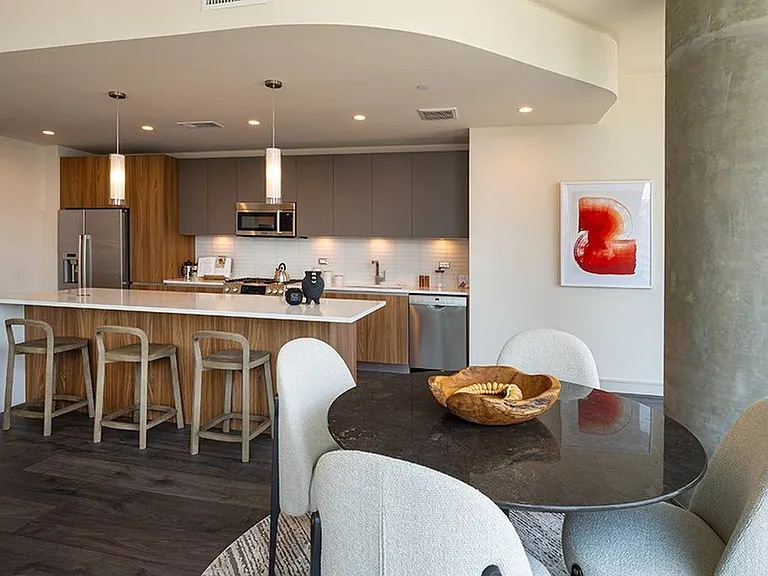 Sleek design, warm finishes_this kitchen is made for both cooking and connecting.