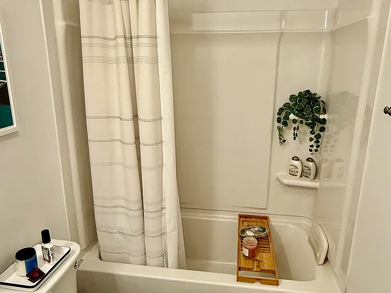 Ensuite second bedroom bathroom complete with tub