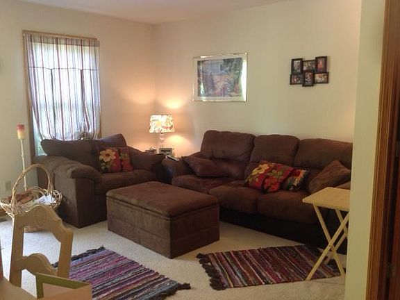 Living room with previous tenant_s furniture