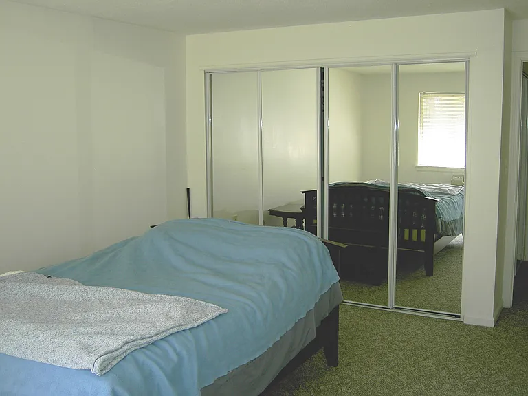 Bedroom W/full wall of mirrored closets