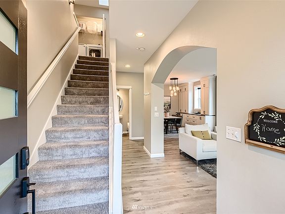 Dedicated formal entry with open staircase.  A skylight at the top of the stairs brings in so much natural light!