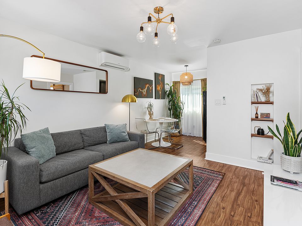 Spacious living room flows into the dining area and kitchen.