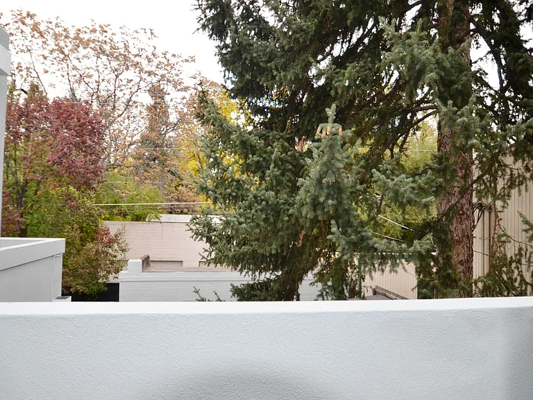 Private balcony overlooks back yard