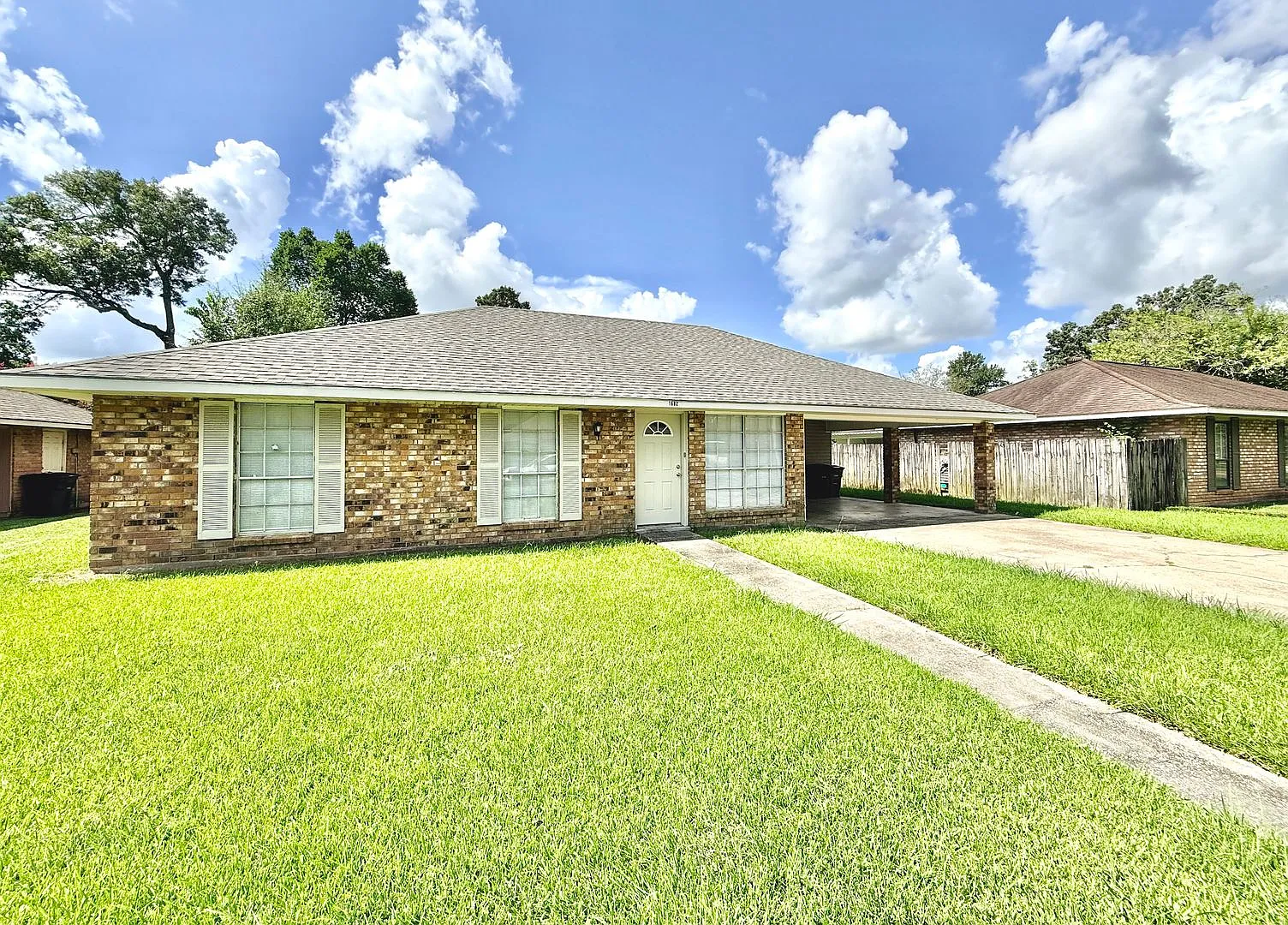 Bright & Spacious 3 Bedroom Brick Home with Double Carport & Large Backyard — Photo 3