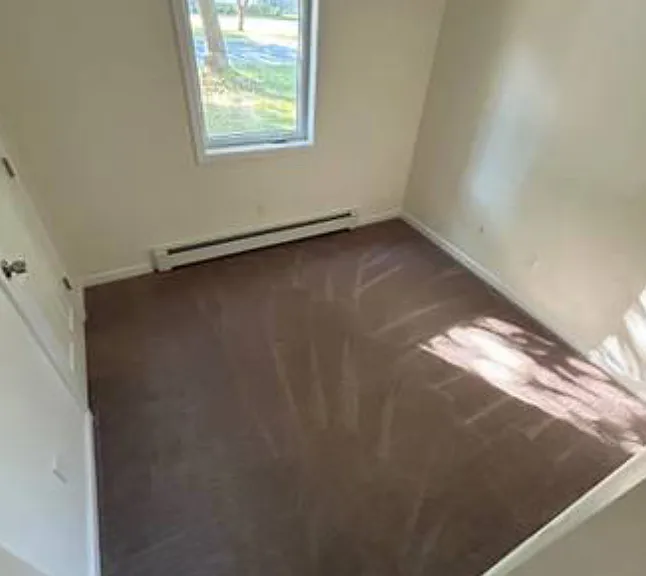 Front bedroom with closet and shelving