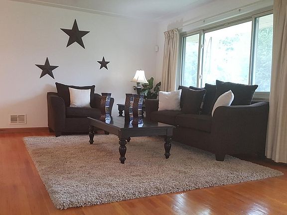 Spacious Living Room with Hardwoods