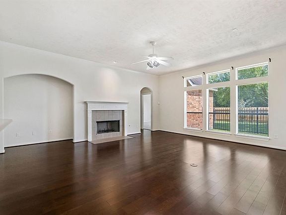 Non-Staged photo of Family room with gas ready fireplace, gorgeous views to backyard, easy access to kitchen and open breakfast area.