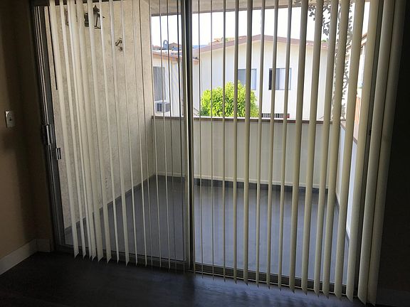 large private balcony overlooking a nicely landscaped courty