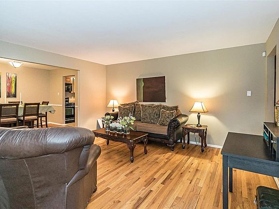 At first greeting, notice the job finished hardwood floors that flow throughout the Living Spaces on both levels of this home.  The Living Room offers complete connection to the Dining Room and perfect spot for after dinner relaxing.  The home features a calming neutral palette throughout the home.